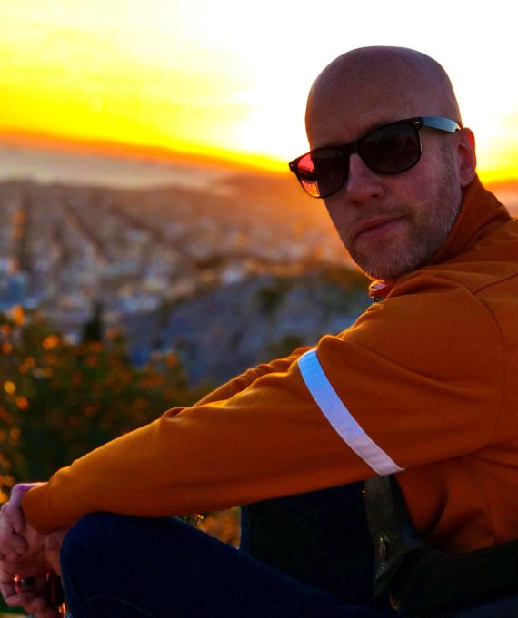 Jake, fully radiant above the city of Athens.